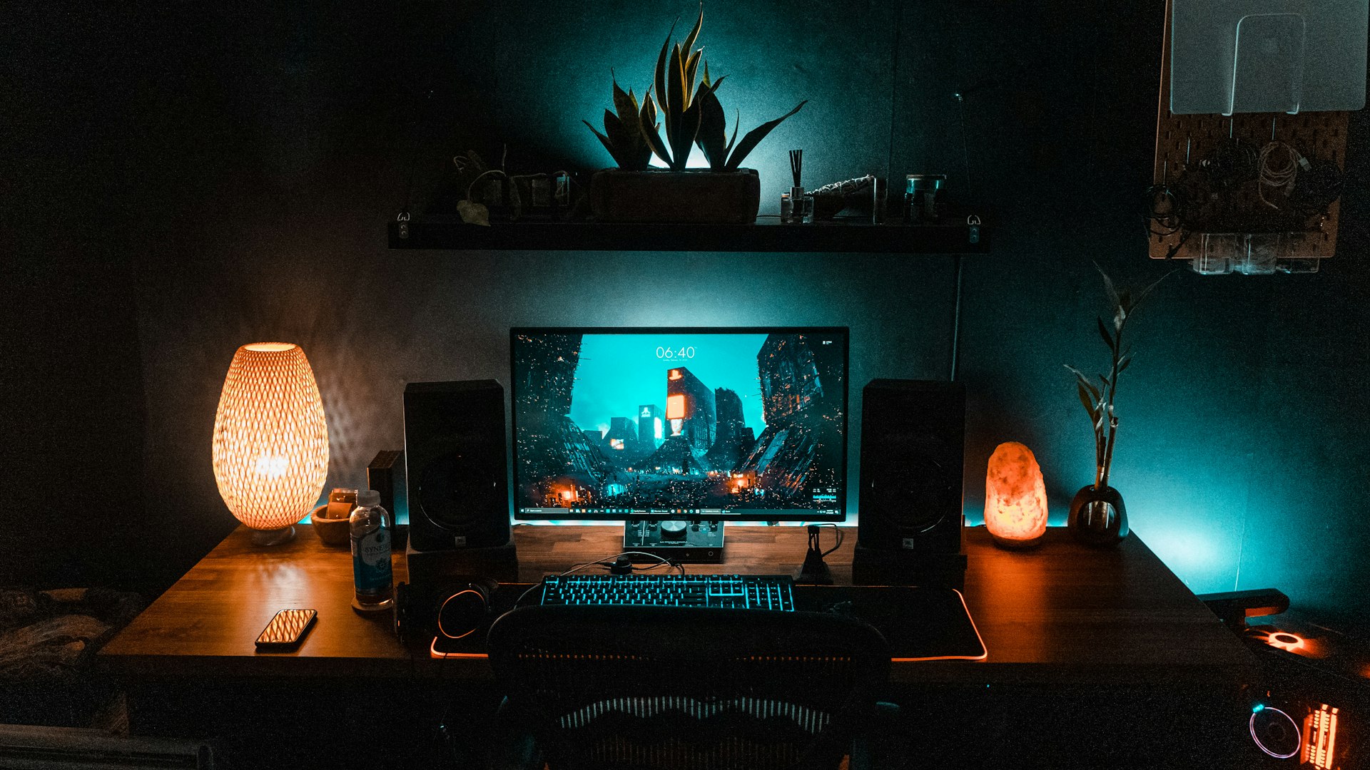 A dimly lit desk with a mechanical keyboard and RPG dice mid-session